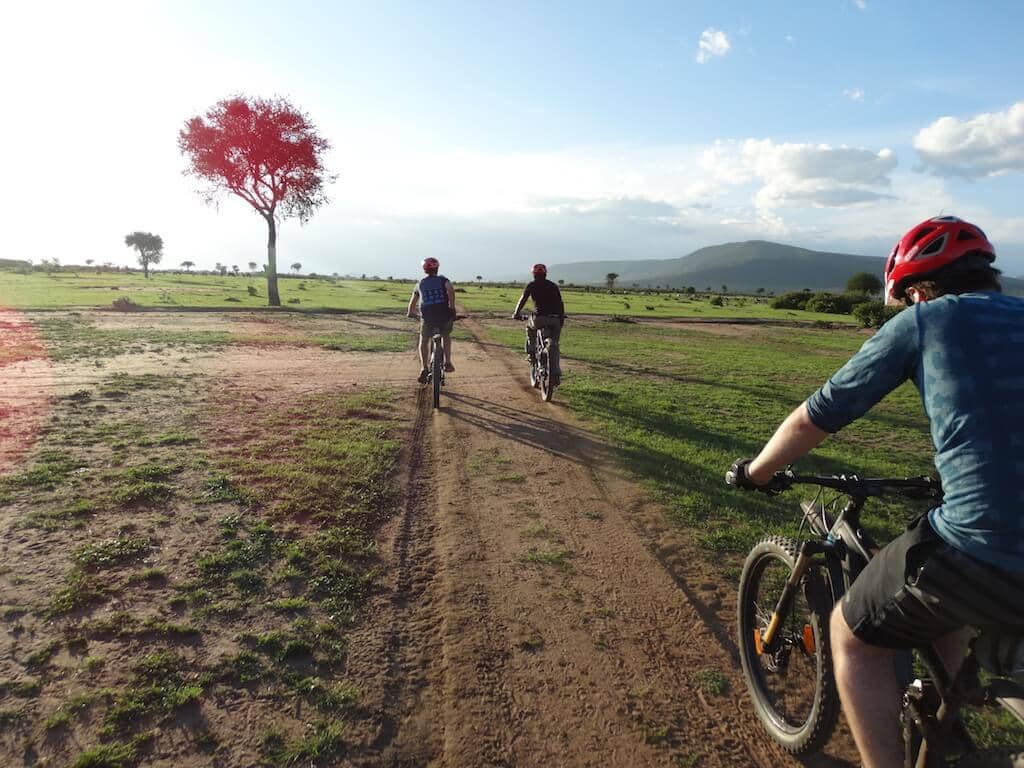 Tourists during safari in Kenya on electric bikes.